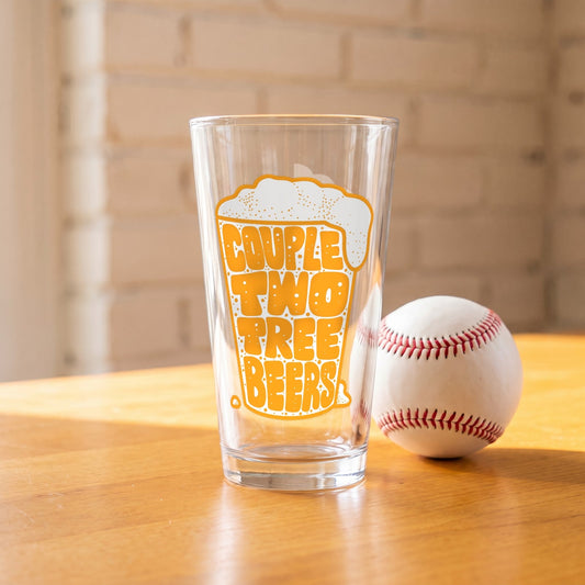 Couple Two Tree Beers Pint Glass on a wood table next to a baseball